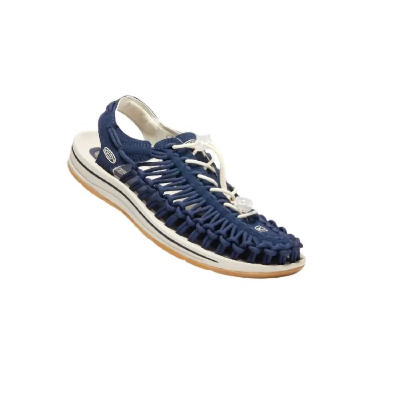Men's sandals with a perforated leather upper for ventilationMen’S Uneek Sandals In Navy/birch Canvas Men's sandals with a perforated leather upper for ventilationMen’S Uneek Sandals In Navy/birch Canvas